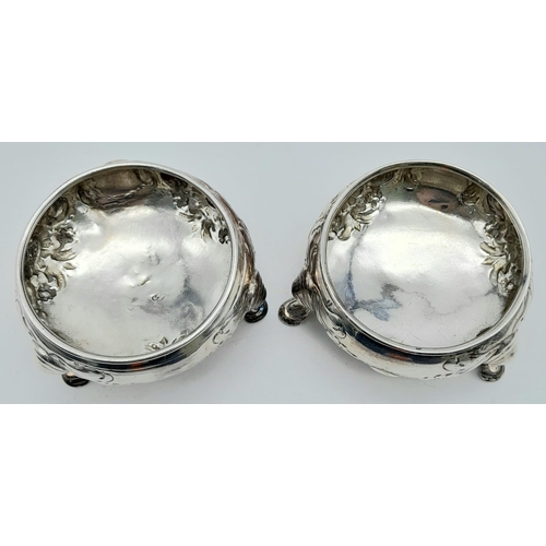 205 - A Pair of Antique Sterling Cauldron-Shaped Sterling Silver Salt Pots. Chased floral decoration throu... 