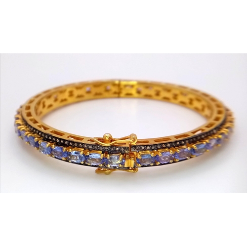 129 - A Gorgeous Blue Tanzanite and Diamond Gemstone Bracelet set in Gold-Plated 925 Silver. A central row... 