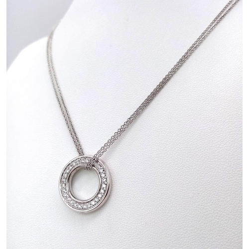 65 - An 18K White Gold and Diamond Boodles Designer Roulette Pendant on an 18K Gold Boodles Designer Neck... 