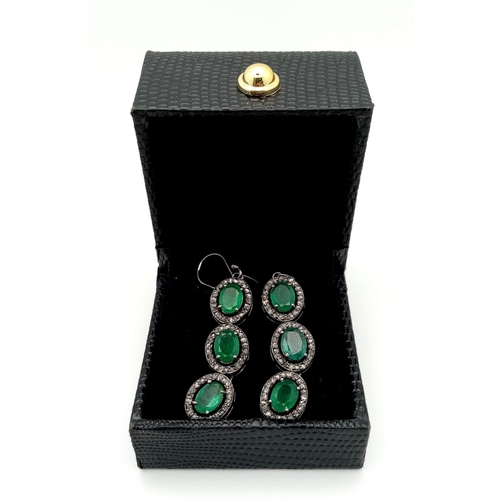 72 - A Pair of Emerald and Diamond Gemstone Dangler Earrings set in 925 Silver. Emeralds - 14ctw (approx)... 