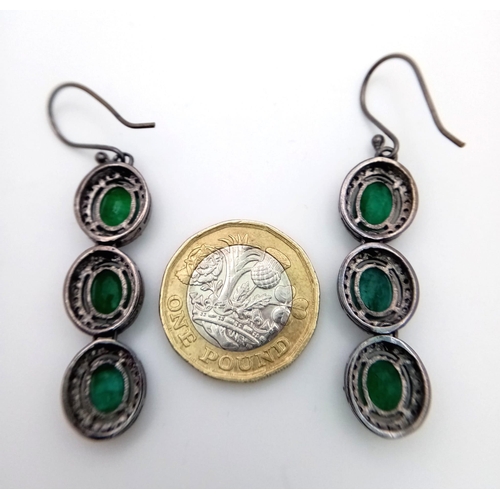 72 - A Pair of Emerald and Diamond Gemstone Dangler Earrings set in 925 Silver. Emeralds - 14ctw (approx)... 