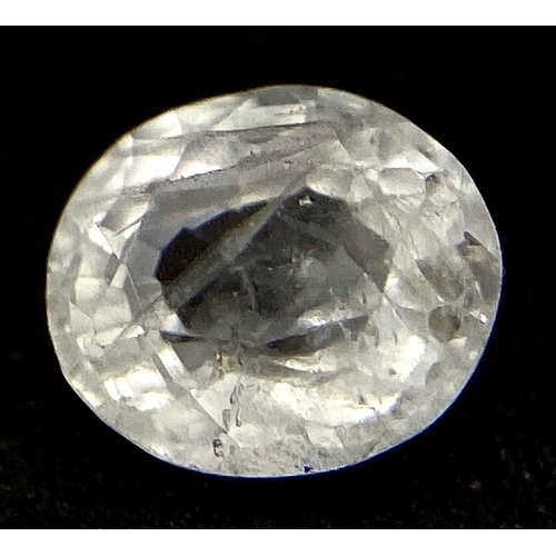 1390 - A 0.78ct Madagascar Natural White Sapphire, in the Oval Faceted cut. Comes with the AIG Certificate.