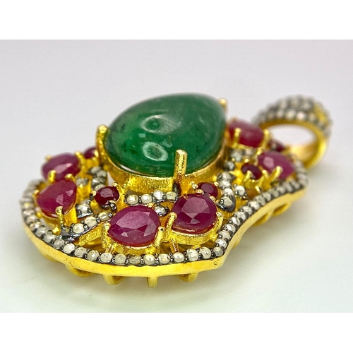 234 - An Emerald, Ruby and Diamond Shield Pendant set in Gold Plated 925 Silver. A central 8ct teardrop em... 