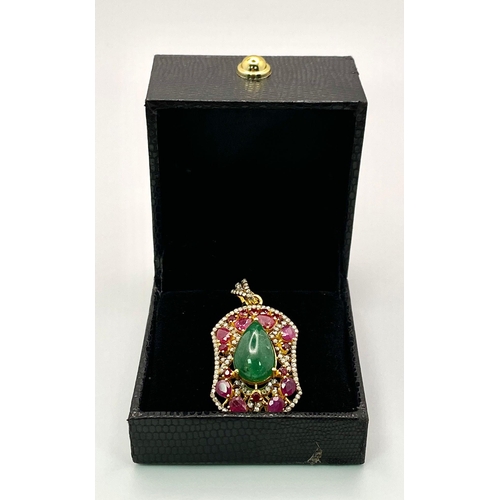 234 - An Emerald, Ruby and Diamond Shield Pendant set in Gold Plated 925 Silver. A central 8ct teardrop em... 