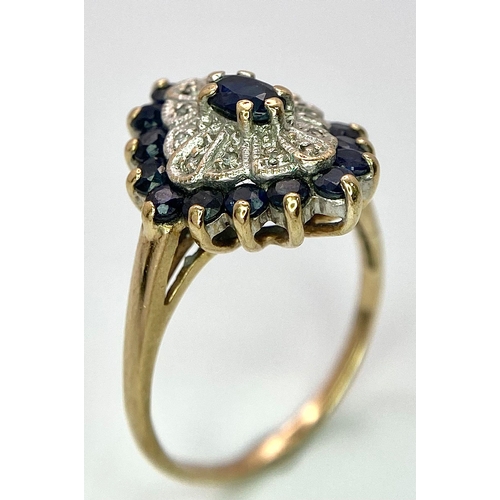 663 - A 9K Yellow Gold Diamond & Sapphire Cluster Ring. One stone missing. Size O, 3.2g total weight.    R... 