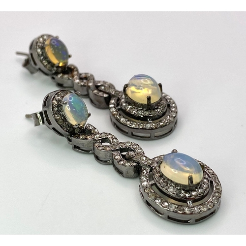 79 - A Beautiful Pair of Opal and Diamond Drop Earrings set in 925 Silver. Diamond weight approx 2ctw. Op... 