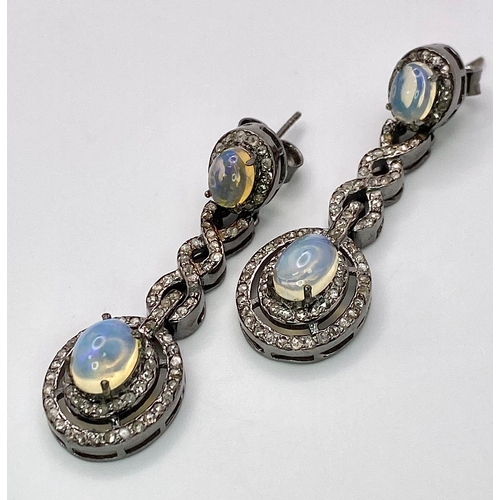 79 - A Beautiful Pair of Opal and Diamond Drop Earrings set in 925 Silver. Diamond weight approx 2ctw. Op... 