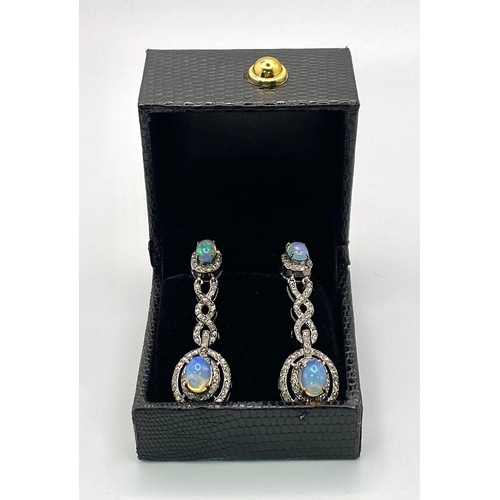 79 - A Beautiful Pair of Opal and Diamond Drop Earrings set in 925 Silver. Diamond weight approx 2ctw. Op... 