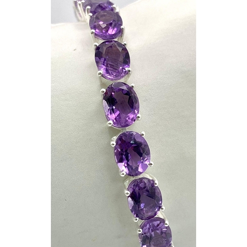 93 - An Amethyst Gemstone Tennis Bracelet set in 925 Silver. 19cm length. 21.10g total weight. Ref: CD-11... 