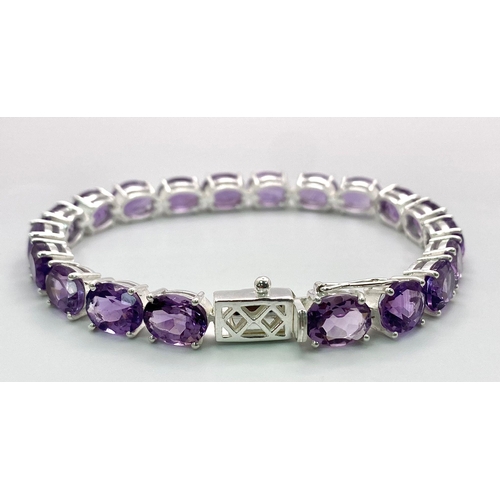 93 - An Amethyst Gemstone Tennis Bracelet set in 925 Silver. 19cm length. 21.10g total weight. Ref: CD-11... 