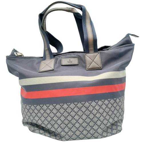 227 - A Gucci Navy 'Diamante' Bag. Textile exterior with brown leather features, two textile and leather h... 