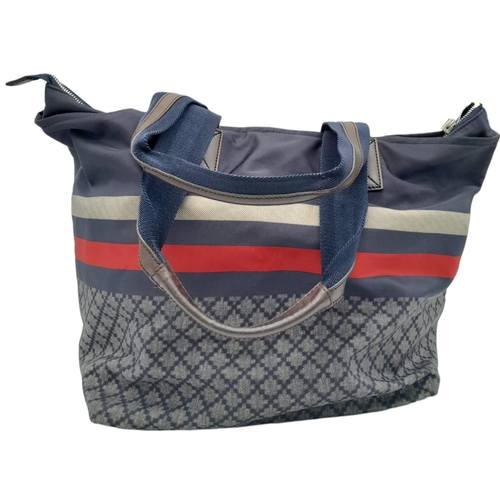 227 - A Gucci Navy 'Diamante' Bag. Textile exterior with brown leather features, two textile and leather h... 