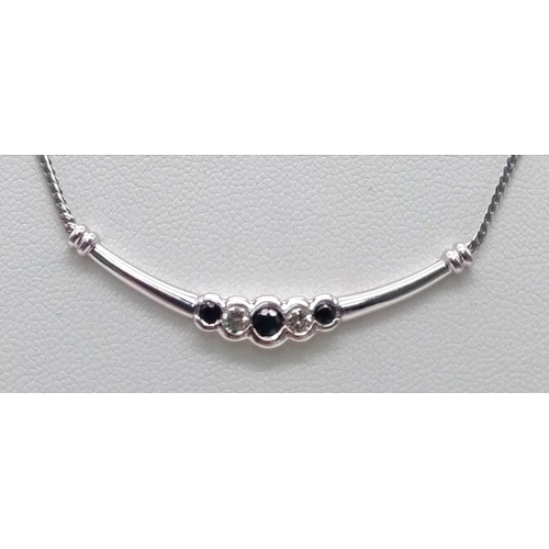 314 - A 9K WHITE GOLD DIAMOND & SAPPHIRE PENDANT ON CHAIN NECKLACE 4G  43.7cm 

ref: SC 1046