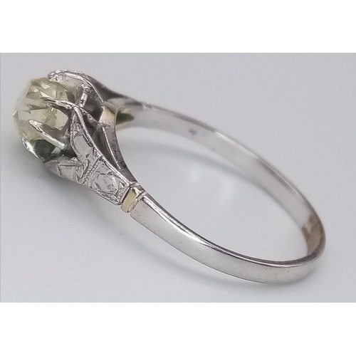 319 - An 18K White Gold and Yellow Diamond Solitaire Ring. Size M. 1.88g total weight. Ref: 15704