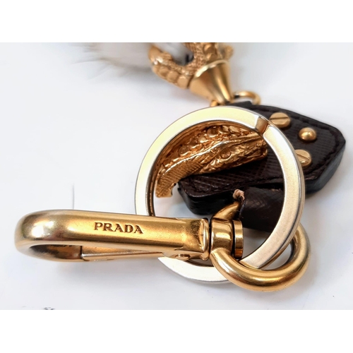 188 - A Prada Furry Key Ring! Gilded hardware with a tough leather body and furry finish. Comes with a dus... 