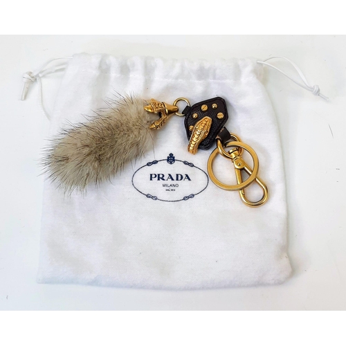 188 - A Prada Furry Key Ring! Gilded hardware with a tough leather body and furry finish. Comes with a dus... 