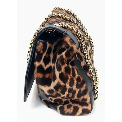 197 - A Christian Louboutin Sweet Charity Leather and Leopard Print Pony Hair Shoulder Bag. Gold tone hard... 