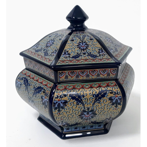 343 - A porcelain, hexagonal lidded vase, probably of Chinese origin, exquisitely decorated on a cobalt bl... 