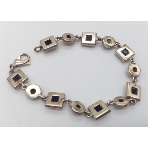 1336 - A Vintage Sterling Silver Green Amber Tennis Bracelet. 18cm Length. Set with Round and Square Cut Gr... 