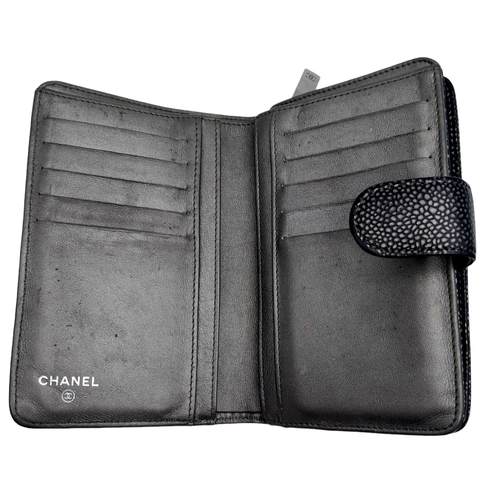 740 - A Chanel Metallic Grey Leather Purse/Wallet. Textured leather exterior with embossed CC logo. Spacio... 