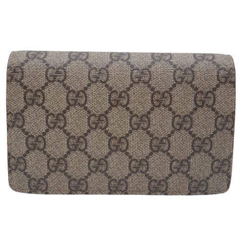 587 - A Gucci Dionysus Chain Wallet. Beige monogram canvas with antique silver tone clasp. Long shoulder c... 