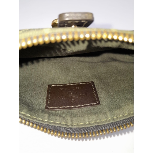 754 - A Louis Vuitton Green Canvas and Leather Wallet/Purse. LV monogram exterior with belt buckle decorat... 