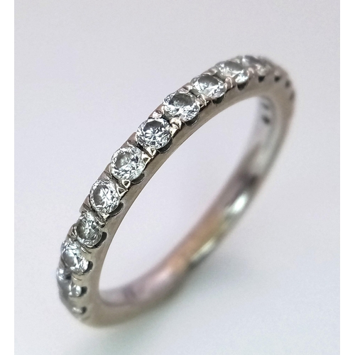 1309 - An 18K White Gold and Diamond Half Eternity Ring. Size K/L.
2.85g total weight. Ref: 15620