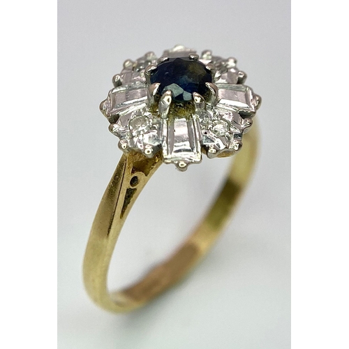 583 - An 18K Yellow Gold Fancy Floral Diamond and Sapphire Ring. A central sapphire with round diamonds an... 