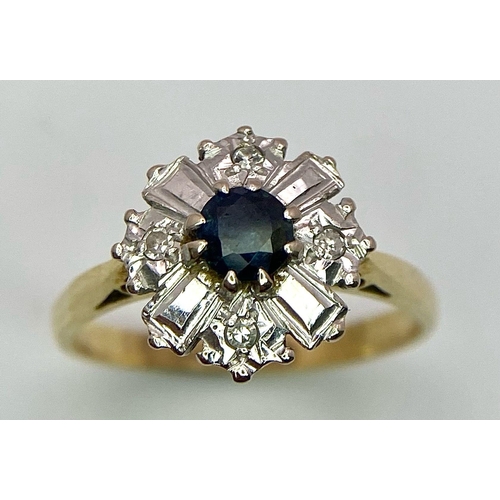 583 - An 18K Yellow Gold Fancy Floral Diamond and Sapphire Ring. A central sapphire with round diamonds an... 