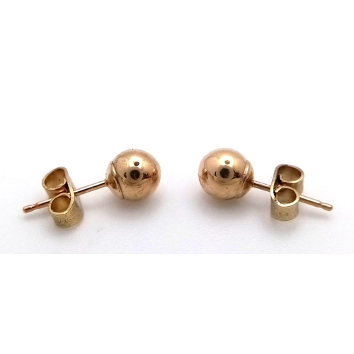 1231 - Two Pairs of 9K Gold Stud Earrings - Pearl and Ball. 2.85g total weight.