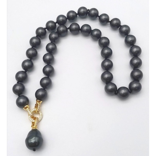 687 - A Metallic Dark Grey South Sea Pearl Shell Bead Necklace with Hanging Teardrop Pendant. 12mm beads. ... 