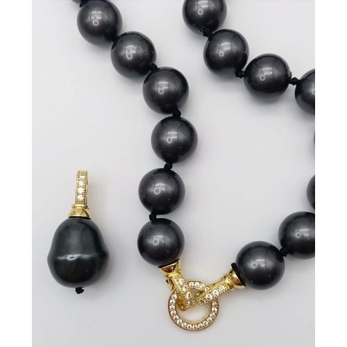 687 - A Metallic Dark Grey South Sea Pearl Shell Bead Necklace with Hanging Teardrop Pendant. 12mm beads. ... 