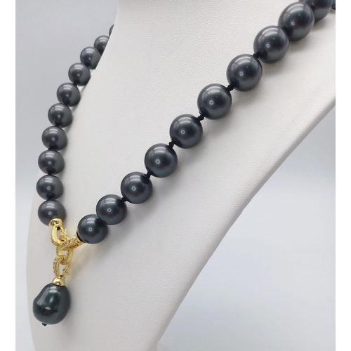 687 - A Metallic Dark Grey South Sea Pearl Shell Bead Necklace with Hanging Teardrop Pendant. 12mm beads. ... 