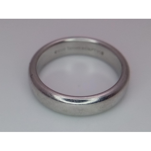 82 - Tiffany and Co Platinum 4mm rounded band ring. 8.2g. Size K.