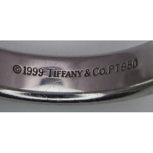 82 - Tiffany and Co Platinum 4mm rounded band ring. 8.2g. Size K.