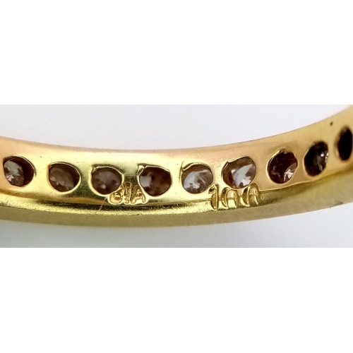 94 - AN 18K YELLOW GOLD DIAMOND SET FULL ETERNITY BAND RING.  APPROX 1CT. 4G. SIZE M 1/2