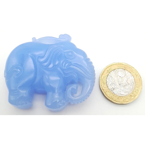 474 - A Sky Blue Jade Decorative Elephant Pendant. 5cm x 4cm.