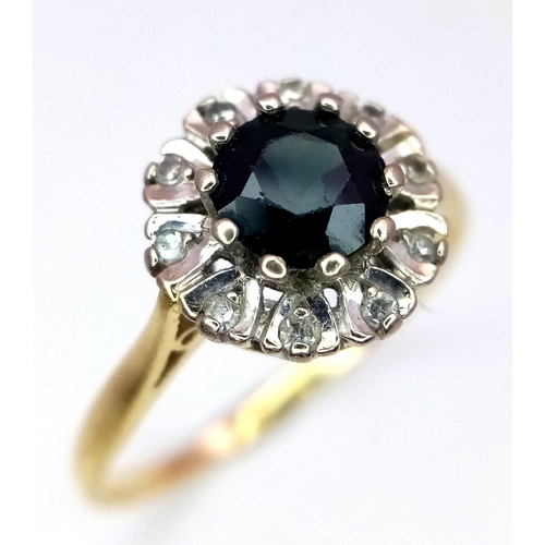 54 - An 18k yellow gold tourmaline and diamond cluster ring (dia:0.10ct/tourmaline:0.75ct). 3.7g. Size V.