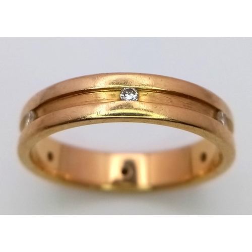 330 - AN 18K GOLD BAND RING WITH 6 INSETDIAMONDS .5.8 gms   size R