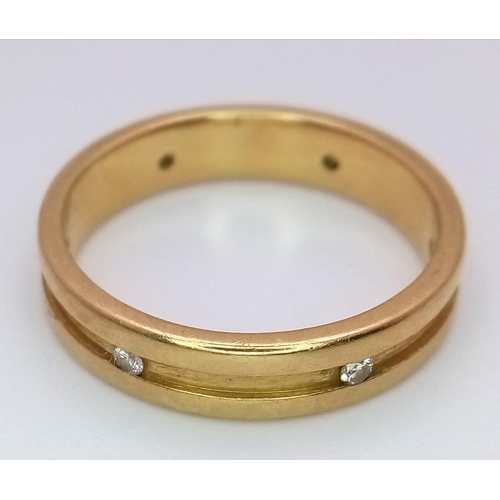 330 - AN 18K GOLD BAND RING WITH 6 INSETDIAMONDS .5.8 gms   size R