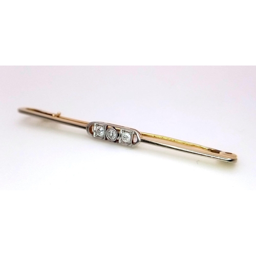 397 - An 18k yellow gold diamond set tie pin with safety catch. 3.6g (dia:.30ct)