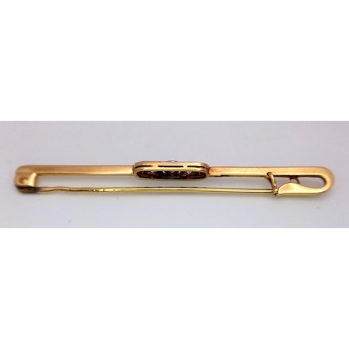 397 - An 18k yellow gold diamond set tie pin with safety catch. 3.6g (dia:.30ct)