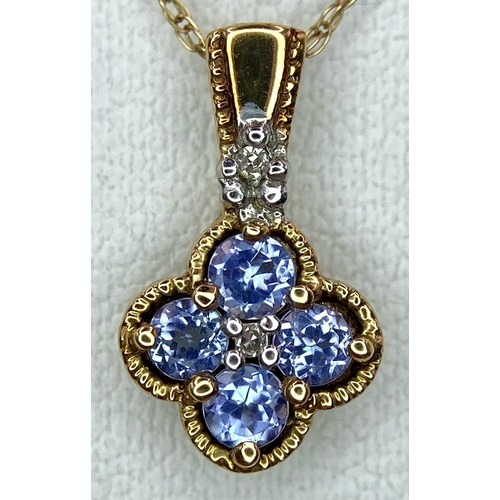 400 - A 9k yellow gold tanzanite and diamond floral cluster necklace and matching earrings. 2.3g total wei... 