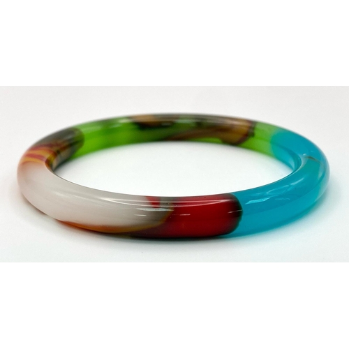 439 - A Kaleidoscopic Jade Thin Bangle. 6cm inner diameter. 8mm width.