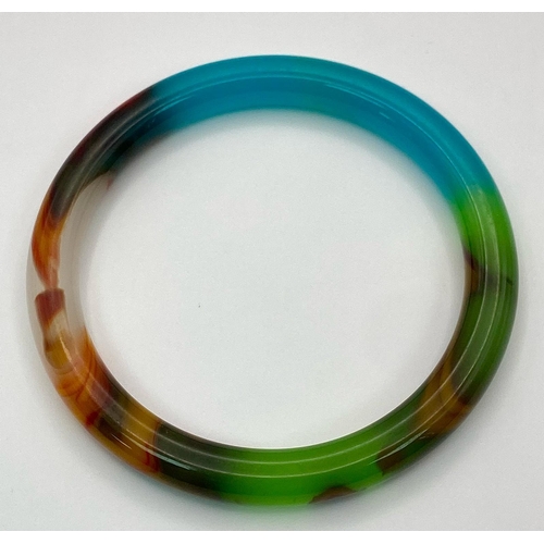 439 - A Kaleidoscopic Jade Thin Bangle. 6cm inner diameter. 8mm width.