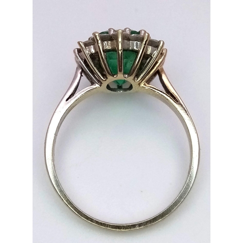 101 - AN 18K WHITE GOLD DIAMOND & EMERALD CLUSTER RING. 0.50CT DIAMONDS & APPROX 2CT EMERALD. 3.6G. SIZE M