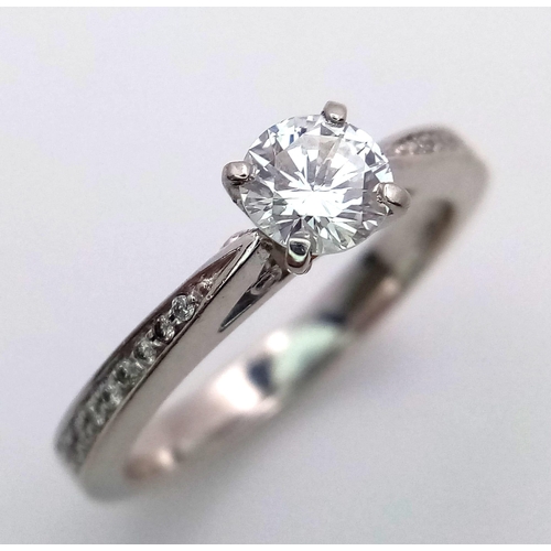 102 - A PLATINUM DIAMOND SOLITAIRE RING WITH DIAMOND SHOULDERS - 0.50CT MAIN STONE. 5.9G. SIZE M. GORGEOUS... 