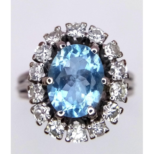 109 - An 18K WHITE GOLD DIAMOND & BLUE STONE (BELIEVED TO BE AQUAMARINE CLUSTER RING 0.60CT DIMAONDS 5.3G ... 