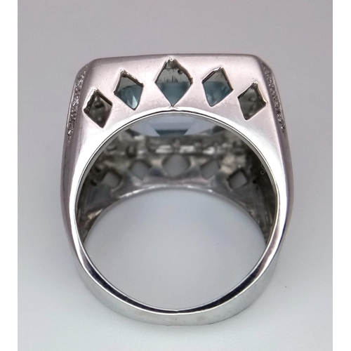 122 - AN 18K WHITE GOLD DIAMOND & AQUAMARINE RING. 10.6G. SIZE J. APPROX 4CT AQUAMARINE.