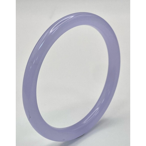 1325 - A Lilac Jade Coloured Thin Bangle. 6cm inner diameter. 8mm width.